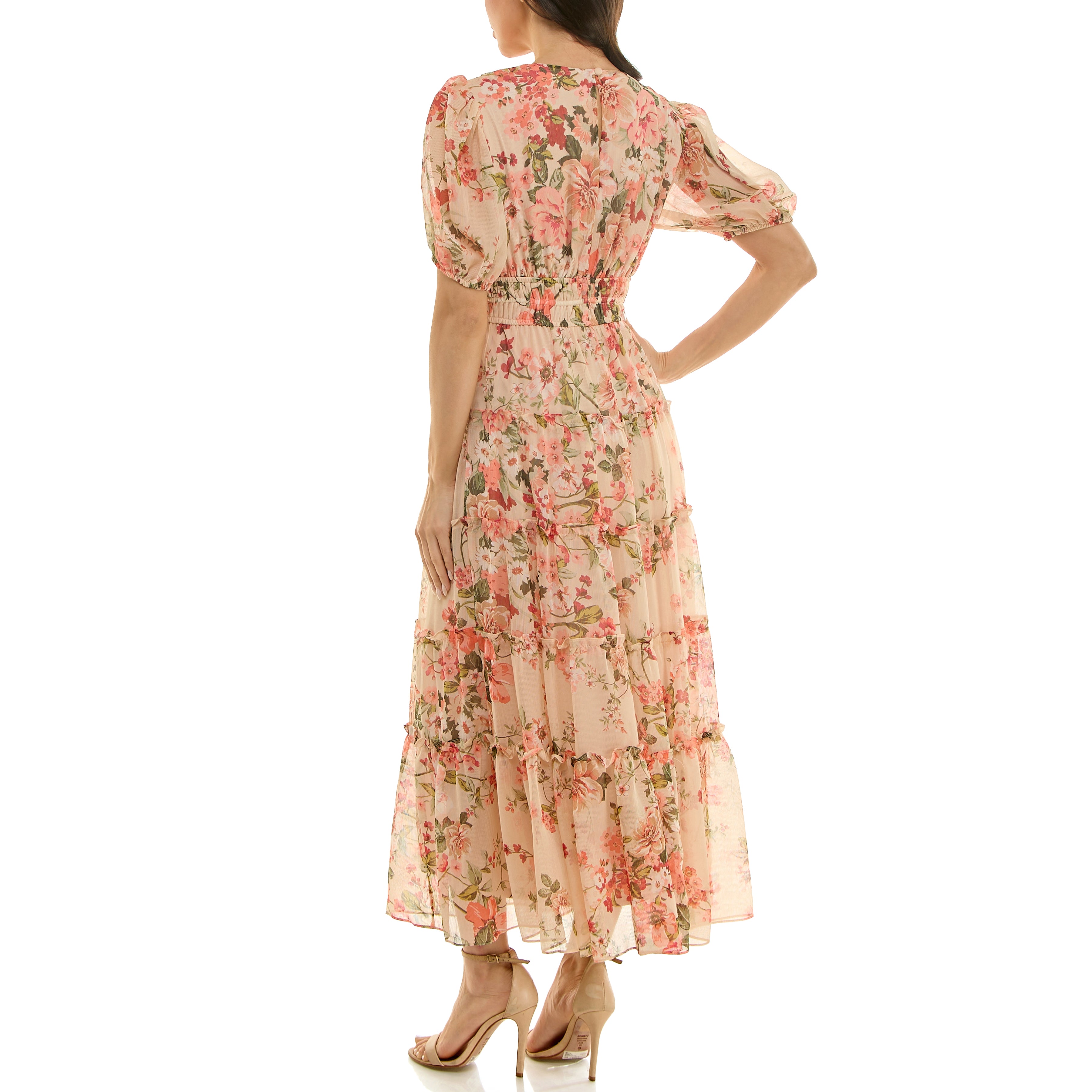 Back view of a floral chiffon maxi dress with smocked waistband, puff sleeves, and flowing tiered skirt.