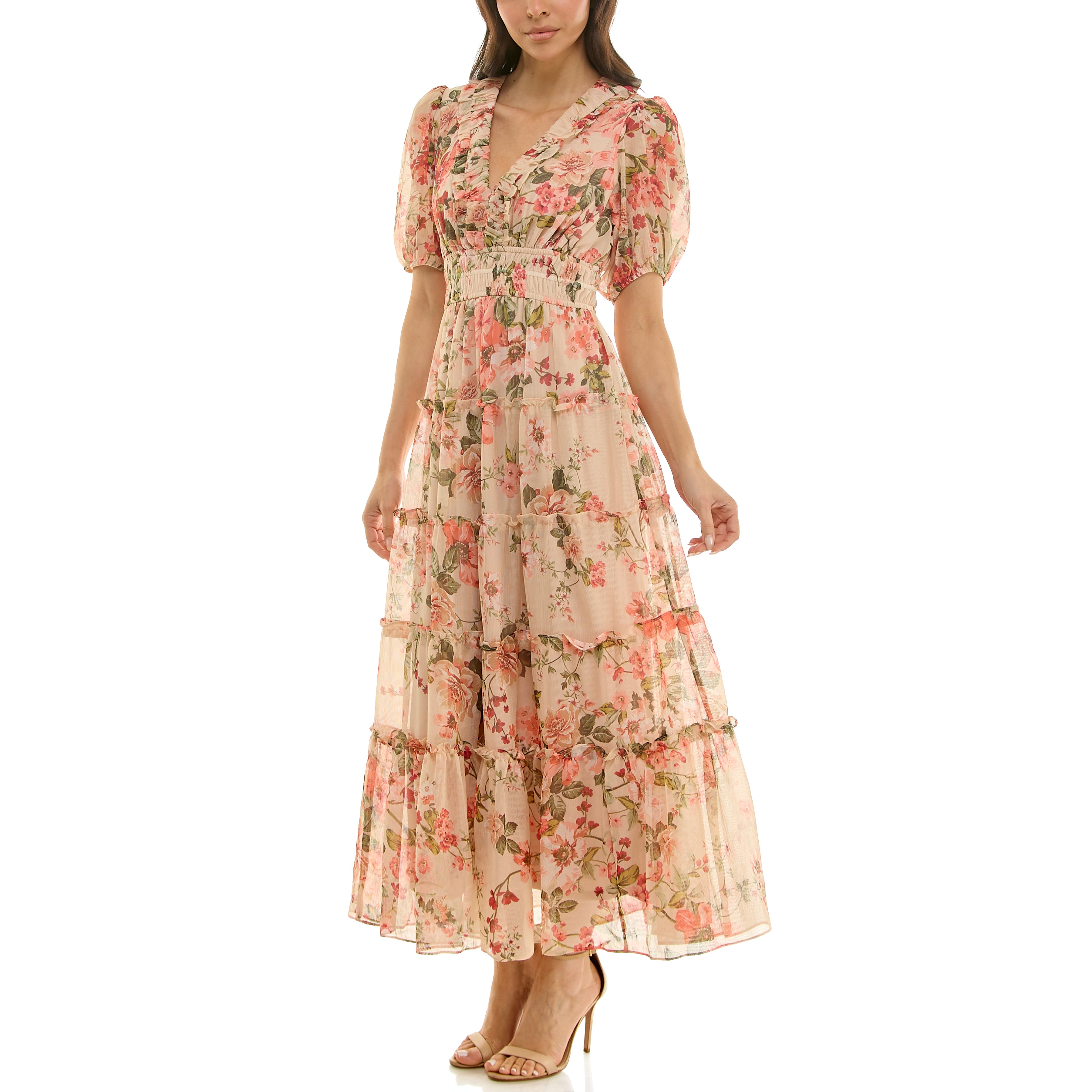 Side view of a floral chiffon maxi dress showing flowy tiered silhouette, short puff sleeves, and smocked empire waist.