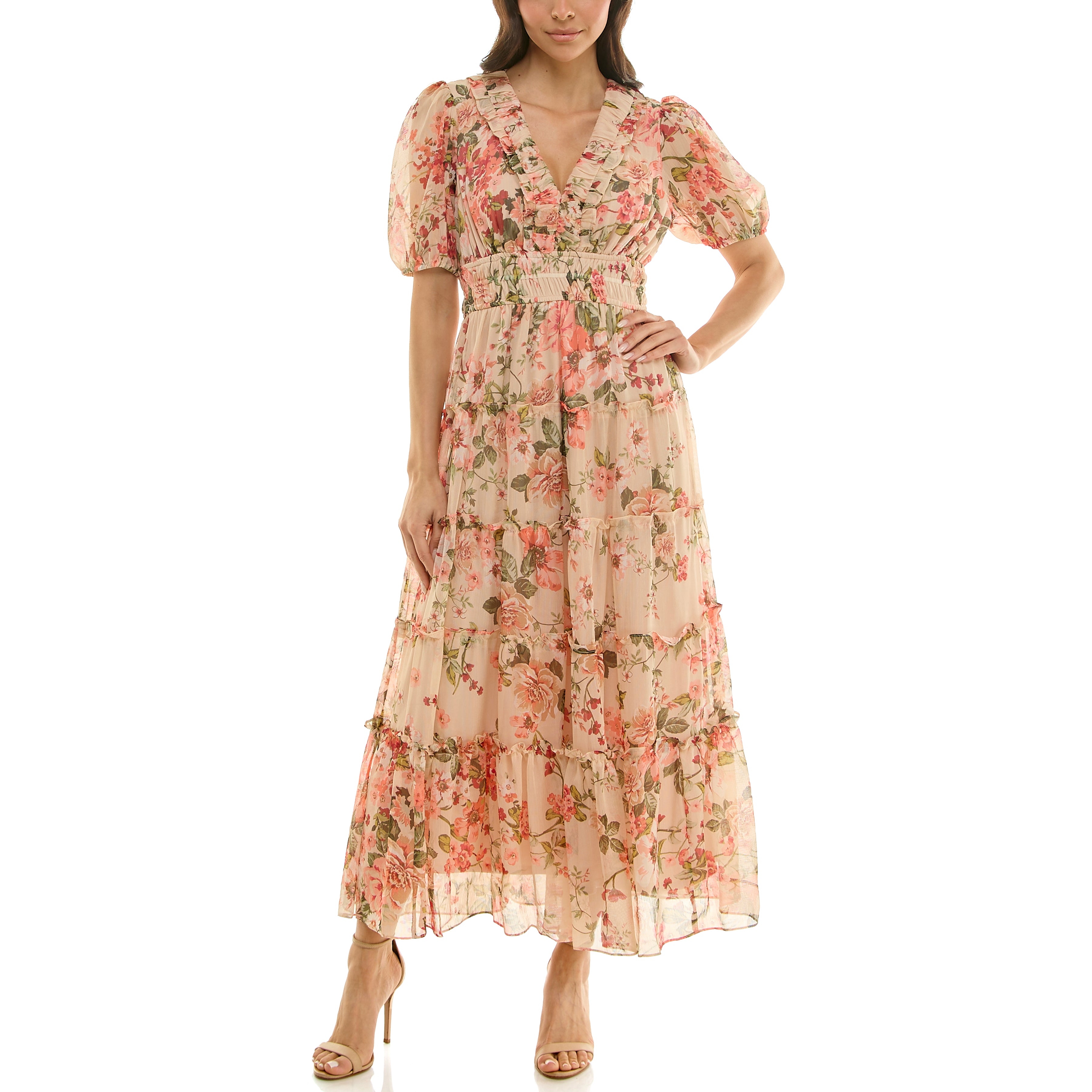 Front view of a floral chiffon maxi dress with ruffled V-neckline, short puff sleeves, smocked waist, and tiered skirt in blush pink and peach.