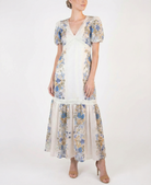 Women’s beige floral midi dress with puff short sleeves, deep V-neckline, lace trim, and flowy A-line silhouette.