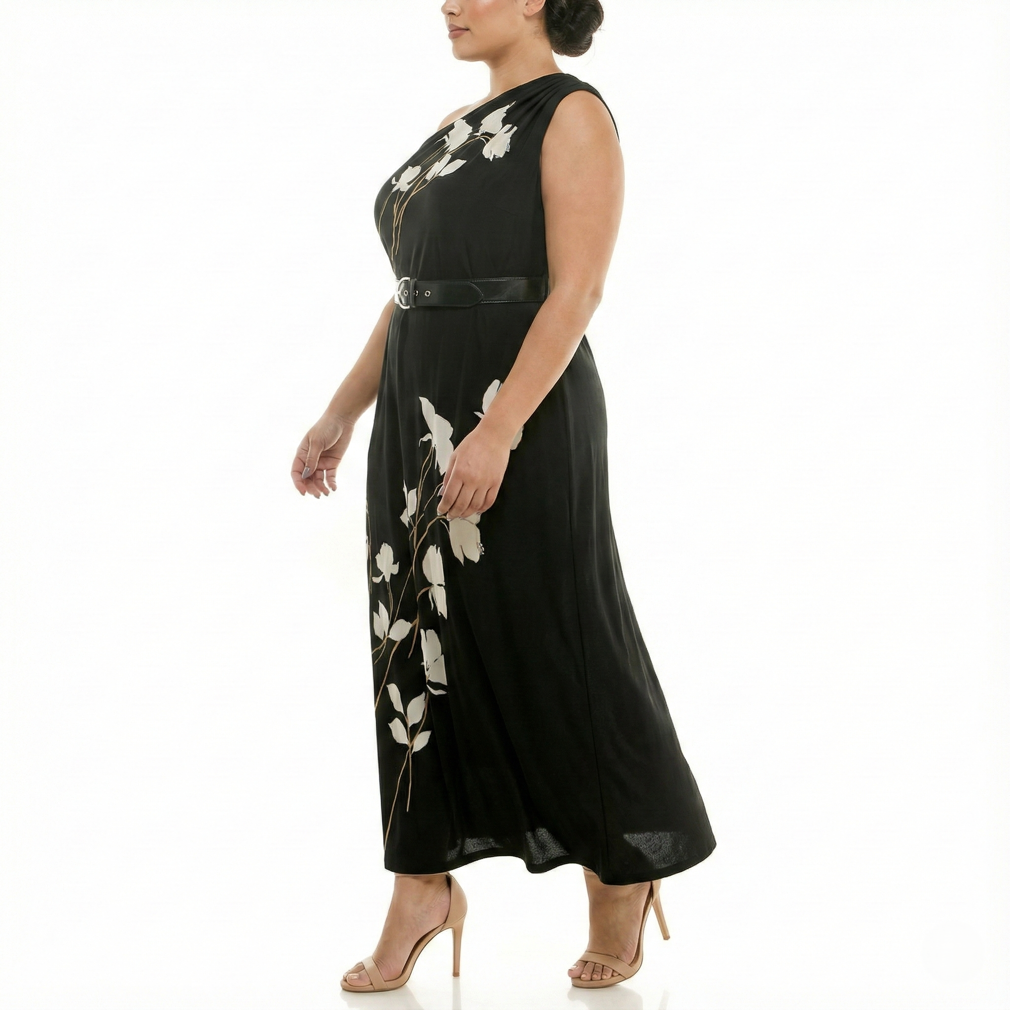 Side view of plus-size black one-shoulder maxi dress with white floral print, belted waist, and soft drape.