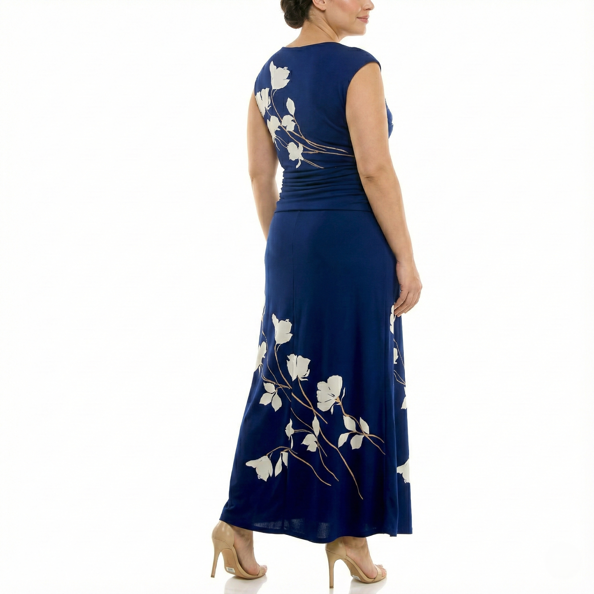 Three-quarter back view of a women’s navy blue sleeveless maxi dress with ivory floral print, featuring a fitted bodice, ruched waist, and elegant floor-length design.