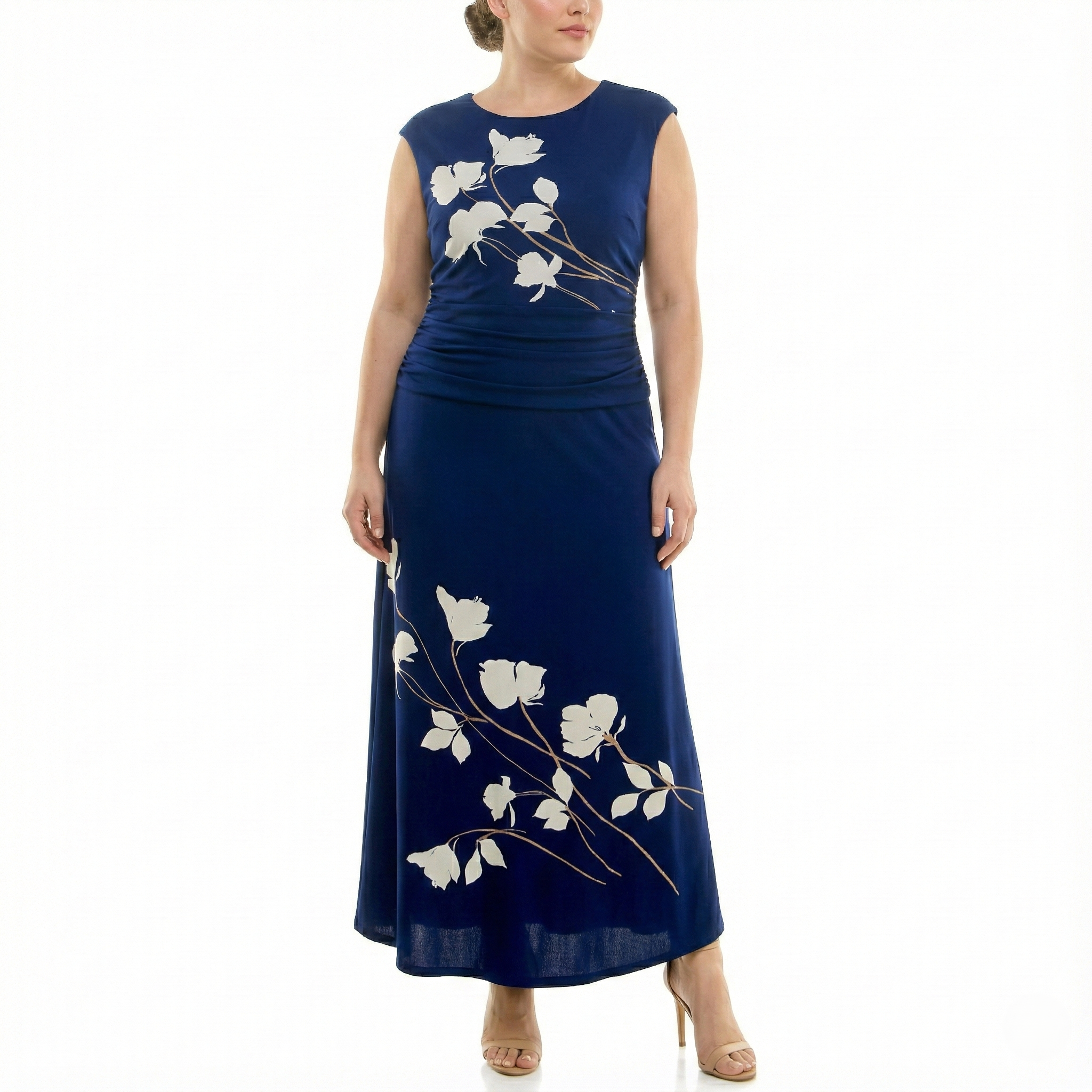 Front view of a women’s navy blue sleeveless maxi dress with ivory floral print, ruched waist detail, and ankle-length skirt, styled with nude heels.