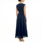 Navy blue sleeveless midi dress with elastic smocked back waist and flowing chiffon skirt, back view.