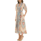 Floral puff-sleeve midi dress with blue center panel and flowing skirt, side view.